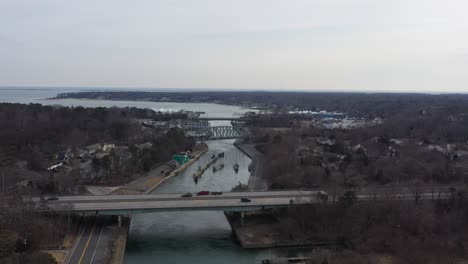 an aerial view over the shinnecock canal in hampton bays, long island, ny