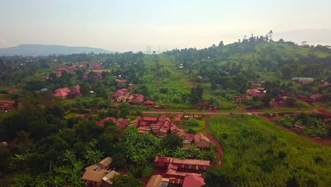 countryside landscape with road and houses in jinja, uganda - aerial shot