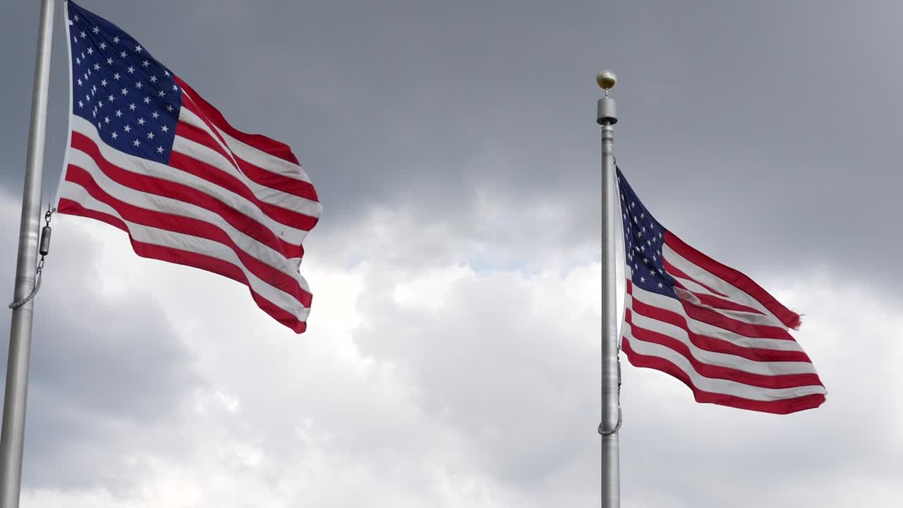 Close up of American flags at the Washington Monument located in Washington DC in the USA