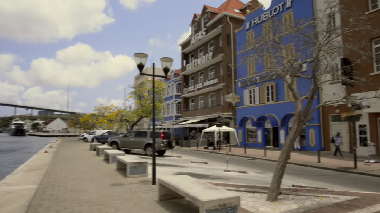 Panning of Sint Anna Bay with Queen Juliana Bridge. Willemstad, Curaçao Waterfront. Dutch Architecture