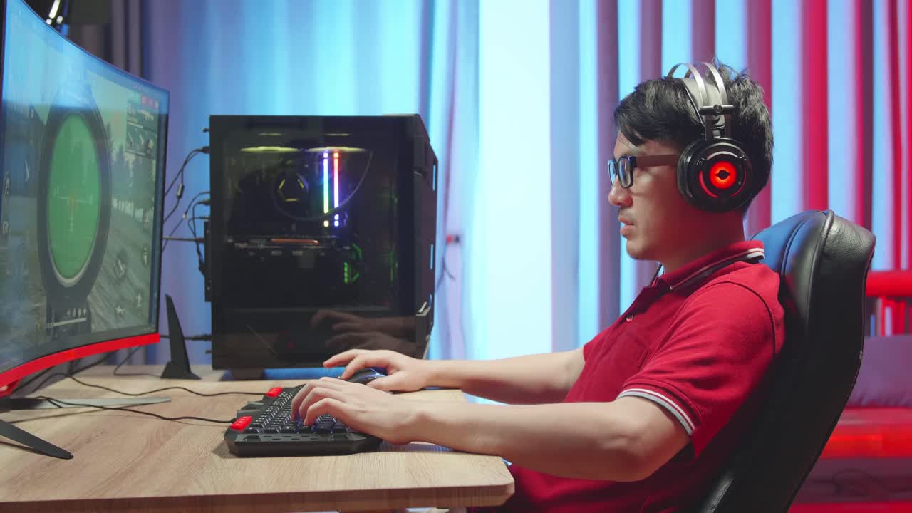 Asian Gamer Man Playing Survival Shooter Games