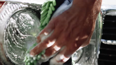 washing headlights on a car on a sunny summer day in canada