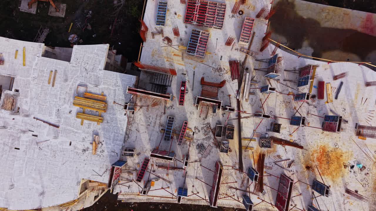 Aerial view of a construction site with buildings and equipment