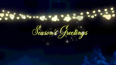 animation of christmas seasons greetings and glowing fairy lights over winter landscape