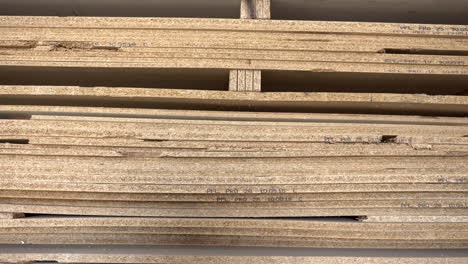 big stack of full format chipboard sorted by thickness on pallet