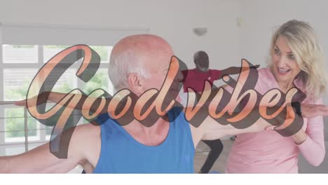 good vibes text against two senior diverse couple performing stretching exercise at home