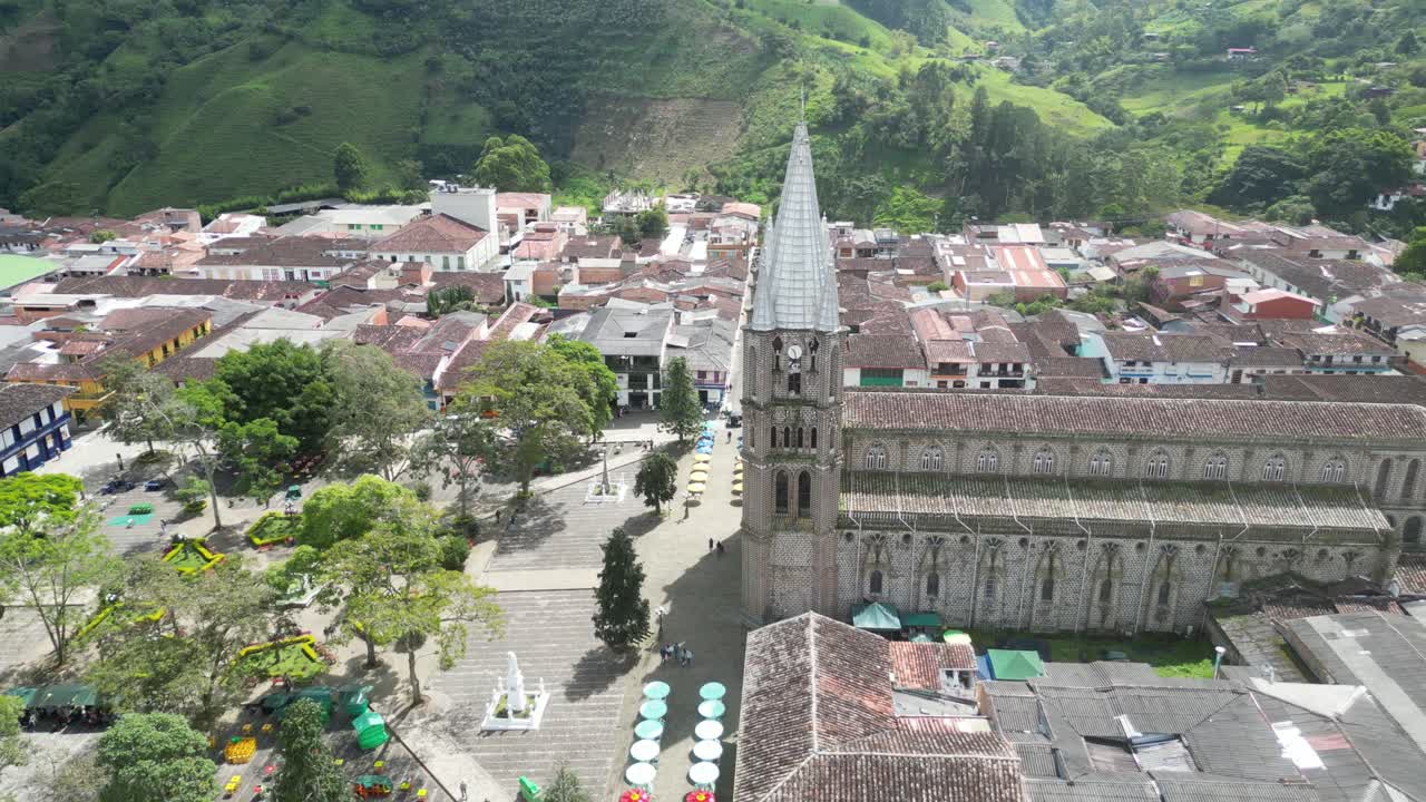 Aerial view of the picturesque church Basílica Menor de la Inmaculada Concepción and the central square in the charming Andean town of Jardín in Colombia