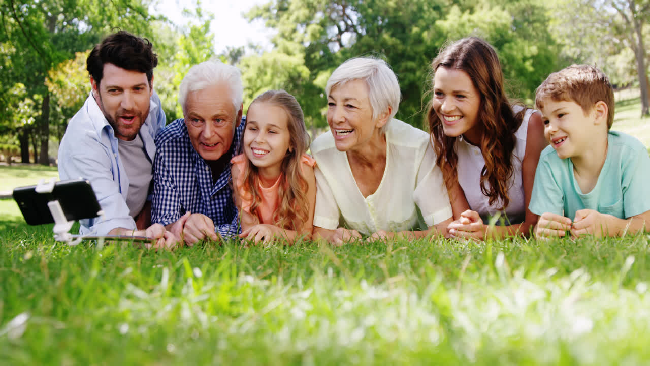 Multi-generation family taking selfie on mobile phone