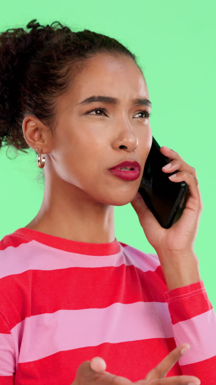 Young Woman Talking on Smartphone with Confused Expression on Green Screen