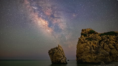 aphrodite rock viewpoint with milky way galaxy above, time lapse view