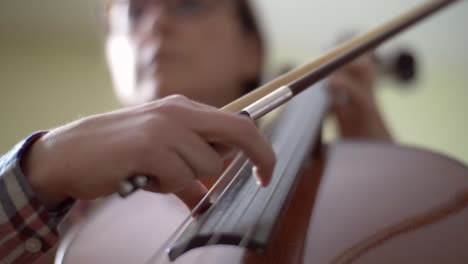 woman playing cello pizzicato