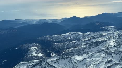 aerial view from a plane, pilot point of view, of the eastern french alps near nice city, with a view the mediterranean sea at the back