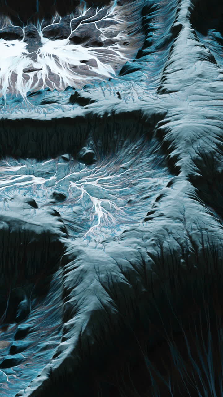 Aerial view of a mountain range with a river running through it