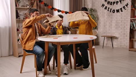 family making halloween paper bag costumes