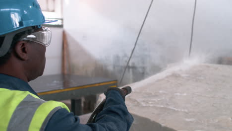 man cleaning marble piece