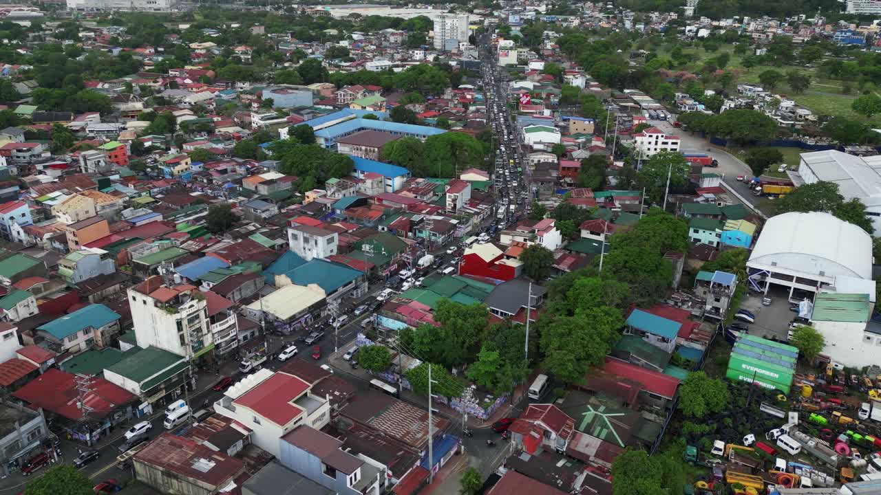 Dense Urban Landscape And Traffic Over Main Road In Marikina, Metro Manila, Philippines. Aerial Drone Shot