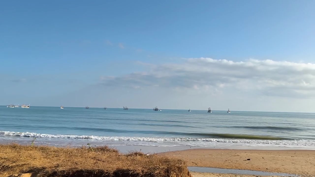 Fishing Boats Anchored in Calm Ocean Waters at Sunrise