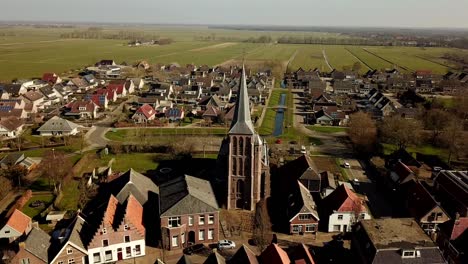 aerial of oldemarkt, dolly shot, pull out of church, revealing town