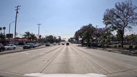 driving on a city street under the carson metrolink silver line