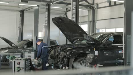 cars undergoing maintenance in auto repair shop