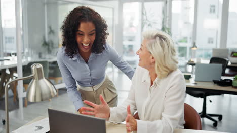 two business women collaborating in office