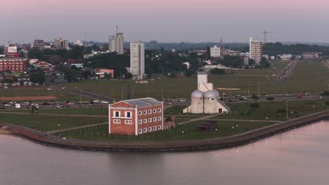sunset over encarnación, paraguay, from an aerial perspective, featuring san josé beach and molino harinero san jose