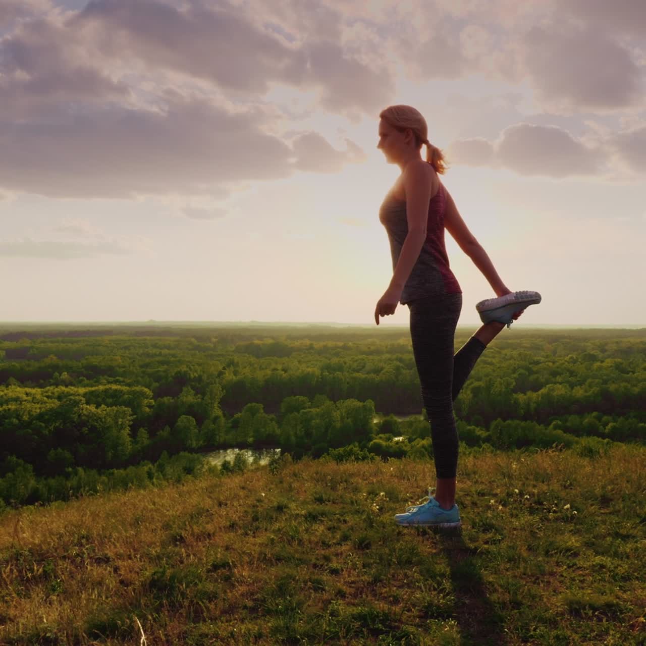 Young Woman Doing Stretching Exercise In An Epic Beautiful Place At Sunset