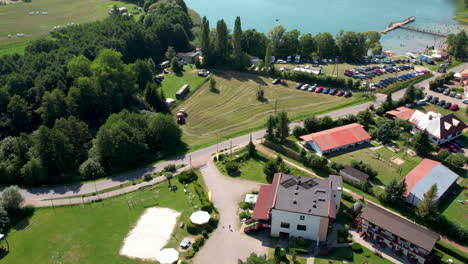 small village of chmielno with beautiful lake and landscape in poland - aerial drone shot