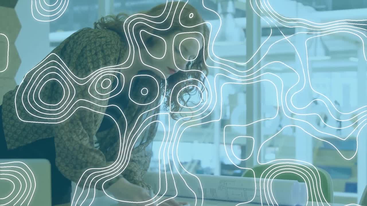 Animation of contour lines moving over woman looking at blueprints on desk