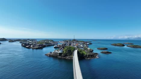 henningsvaer bridge with traffic leading into the village islands and ocean horizon on sunny day