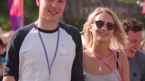 couple walking at a music festival, slow motion