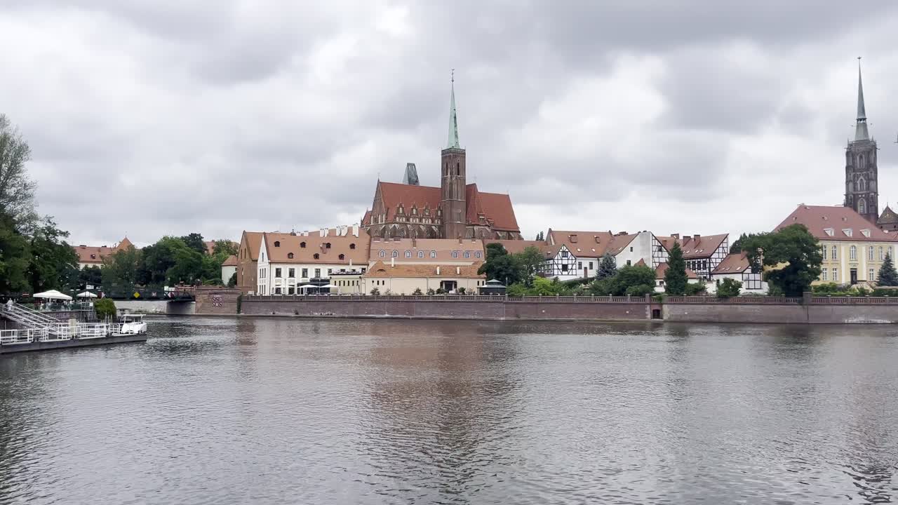 Overlooking Cathedral Island from other side of River Odra on a moody and grey morning in Wrocław, Poland