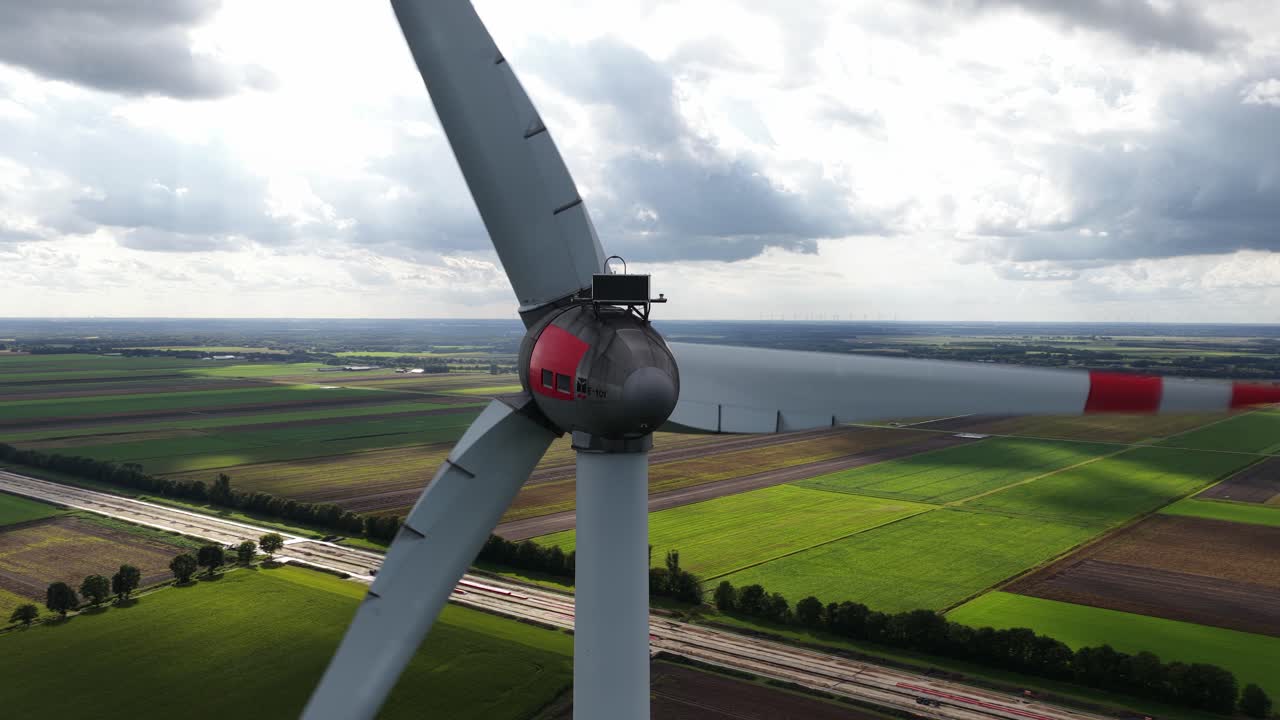 Renewable energy from the wind, wind turbine. Close up aerial video. Clean energy transistion