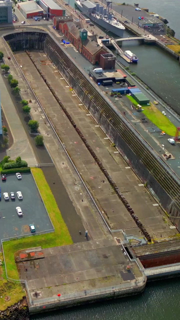 Overhead reversing social ratio aerial video of Thompson Dry Dock in Belfast, County Antrim in Northern Ireland. Produced in 1920x1080 social ratio, 60FPS and with Rec709 color.