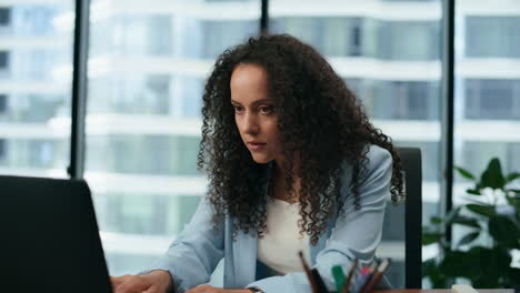 woman surprised job opportunity reading incoming messages at workplace close up