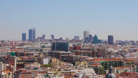 City-skyline-of-Madrid,-capital-of-Spain,-from-a-very-high-roof-of-a-skyscraper