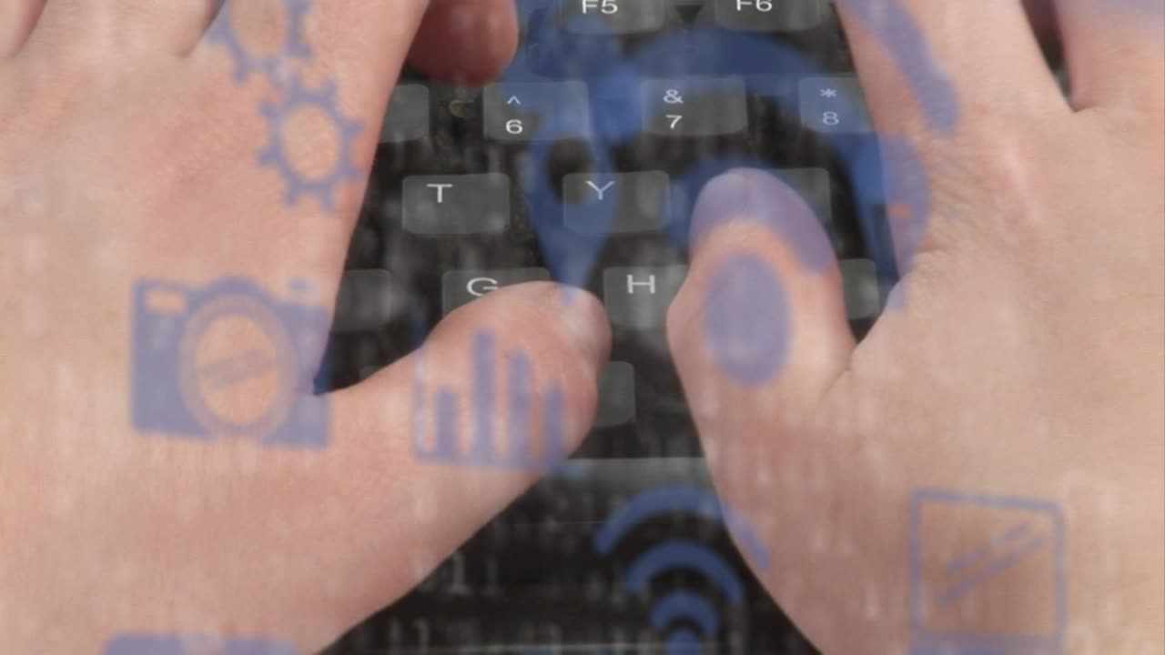 Animation of technology icons over hands of caucasian man typing on keyboard