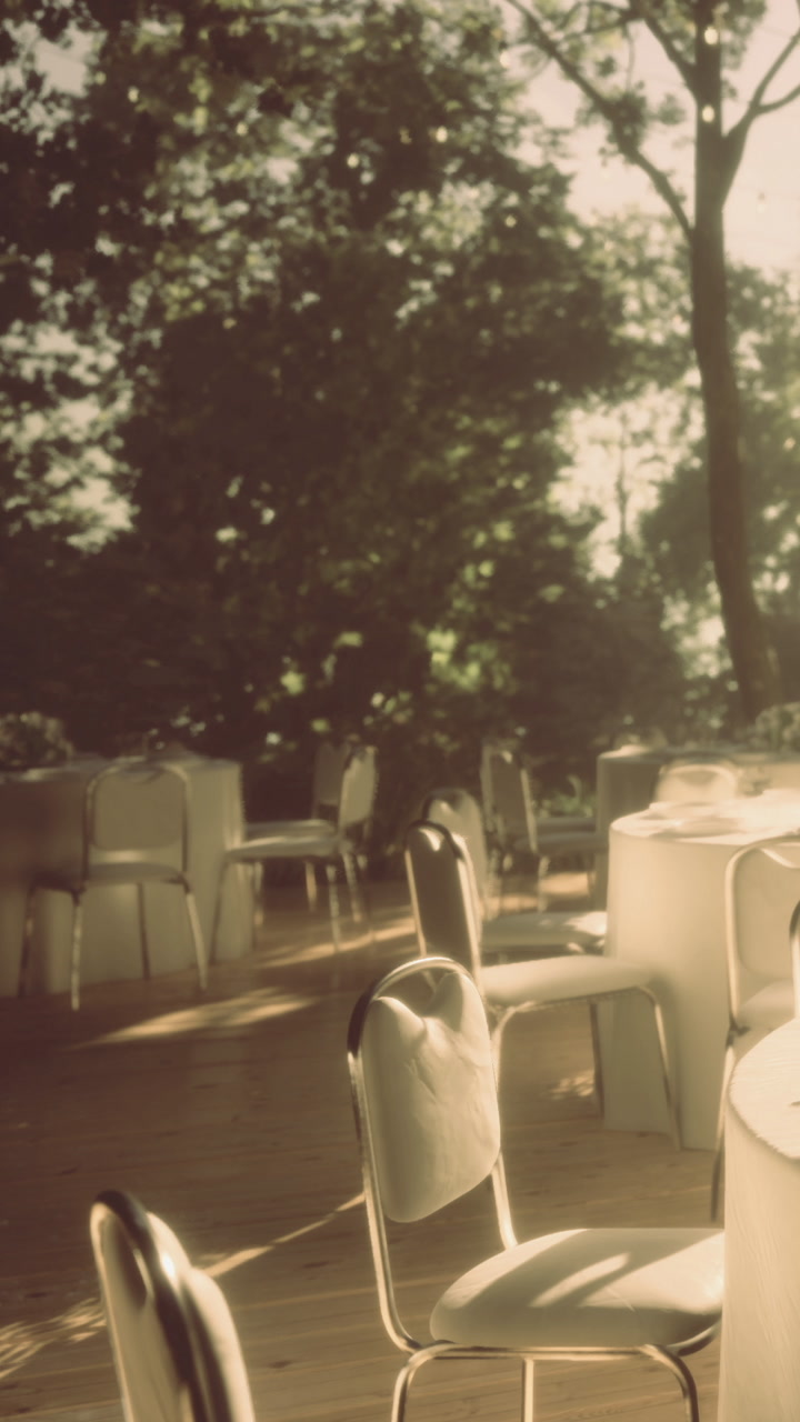 Outdoor event space with empty tables set for gathering in daylight