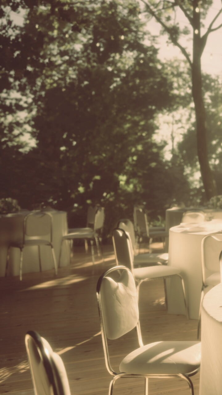 Outdoor event space with empty tables set for gathering in daylight