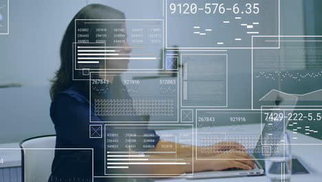 animation of financial data processing over biracial businesswoman using laptop in office