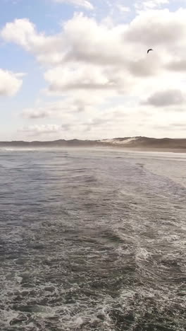 view of waves reaching a shore at beach