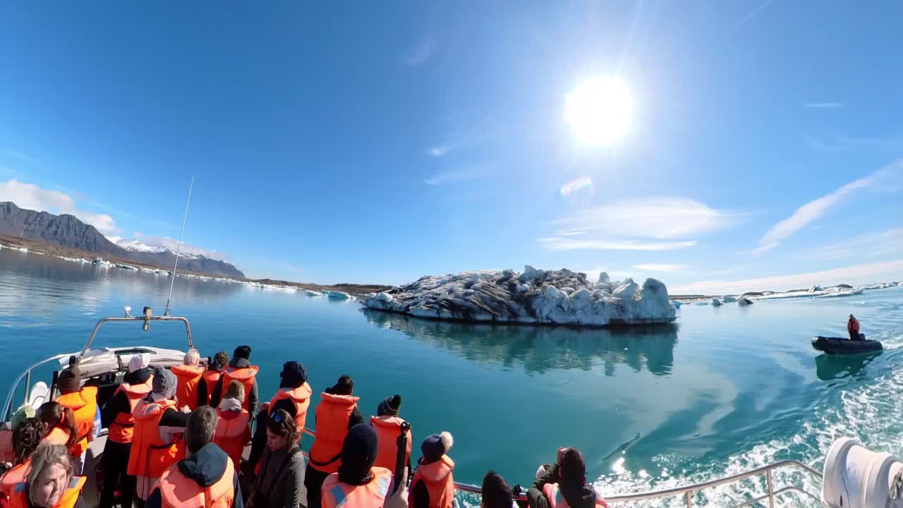 Travelers are mesmerized by the serene beauty of Iceland's picturesque winter landscape, with snow-capped mountains and clear blue skies as far as the eye can see.