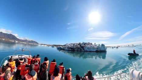 travelers are mesmerized by the serene beauty of iceland's picturesque winter landscape, with snow-capped mountains and clear blue skies as far as the eye can see.