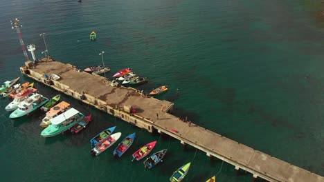 amazing aerial of boats selling fresh fish from the jetty at this caribbean fish market located on the spice island of grenada