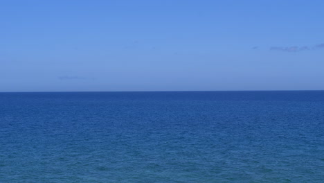 beautiful calm blue sea and cloudless sky. static