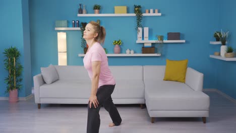 Woman-exercising-at-home.-Leg-stretching.