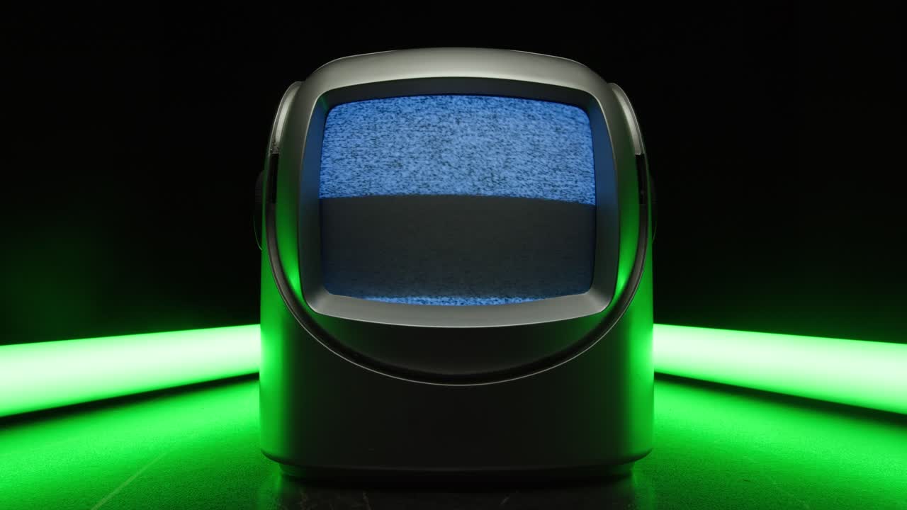 Retro TV, vintage television In a nostalgic setup, a retro TV displays grain on screen, scary halloween night device good for chroma key and green screen. High quality 4k footage