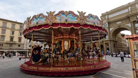 colorful carousel spinning in florence, italy