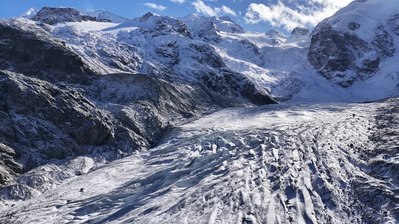 Engadin valley glacier near St Moritz Switzerland, drone moving forward through snowy mountains