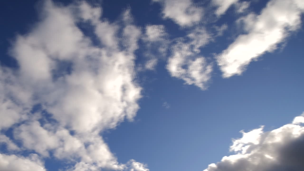 Clouds rolling over sky in windy daytime, low angle time lapse